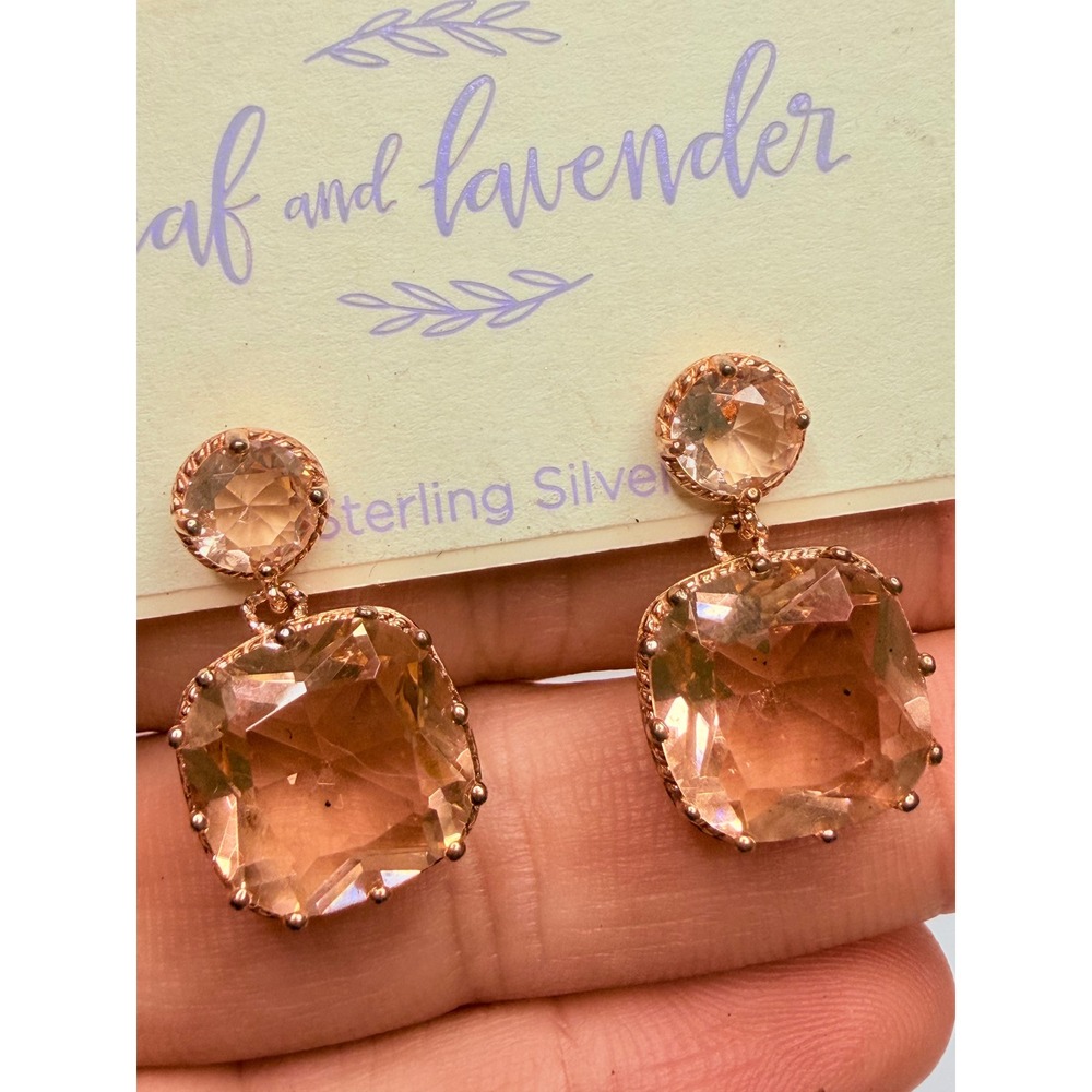 Leaf and Lavender brand earrings feature large, peach-colored silver. - Picture 2 of 5